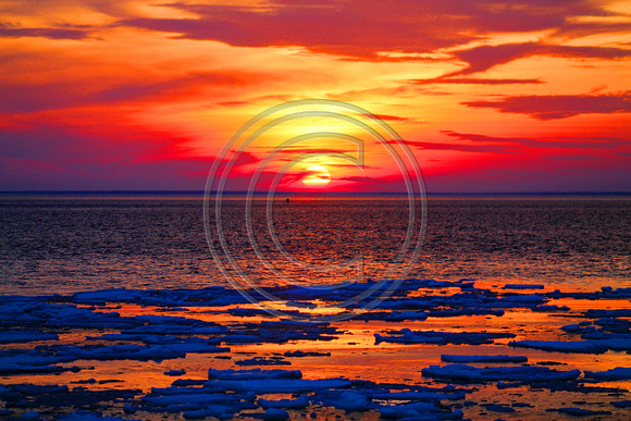Orange,golden & blue sunset frozen Buzzards Bay
