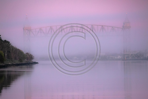 Early morning on the Big Ditch Pink Hue dense fog Railroad Bridge