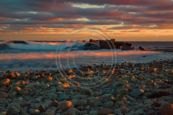 The sun rising with colors waves & rocks Town Neck Sandwich Cape Cod